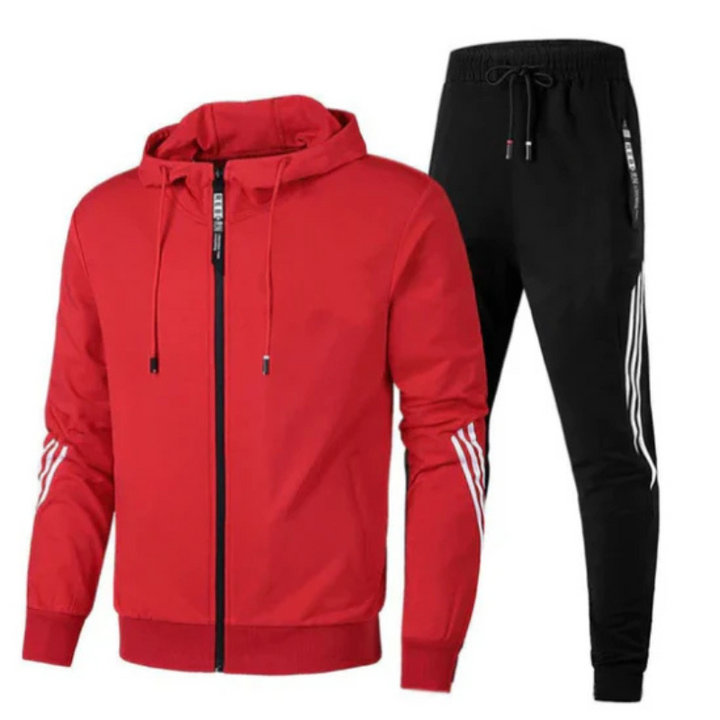 Model wearing a men's casual outfit: a two-piece tracksuit set with a zip hoodie and joggers.