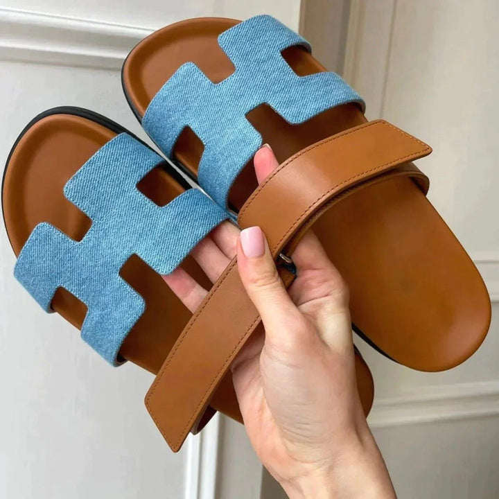 A pair of mens summer sandals showcasing the adjustable strap feature
