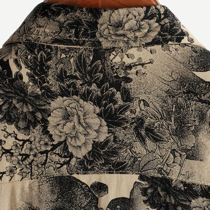 Close-up of men's AirLight vintage blossom floral print short sleeve shirt, showcasing unique design.