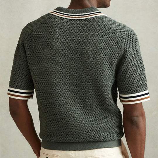 Army green men's polo shirt featuring a distinctive diamond weave texture and short sleeves. Ideal for smart-casual.