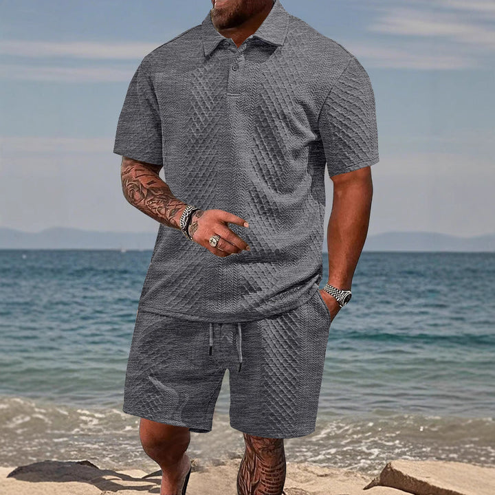 Men's athletic polo shirt & shorts set in blue, perfect for casual summer wear & sports.