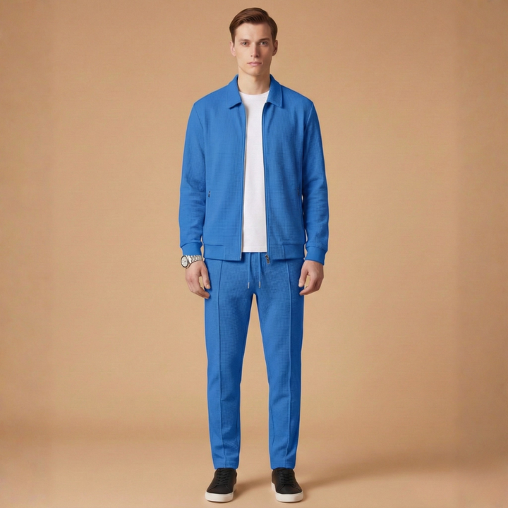 Men's performance activewear tracksuit: zip jacket and coordinated straight pants.