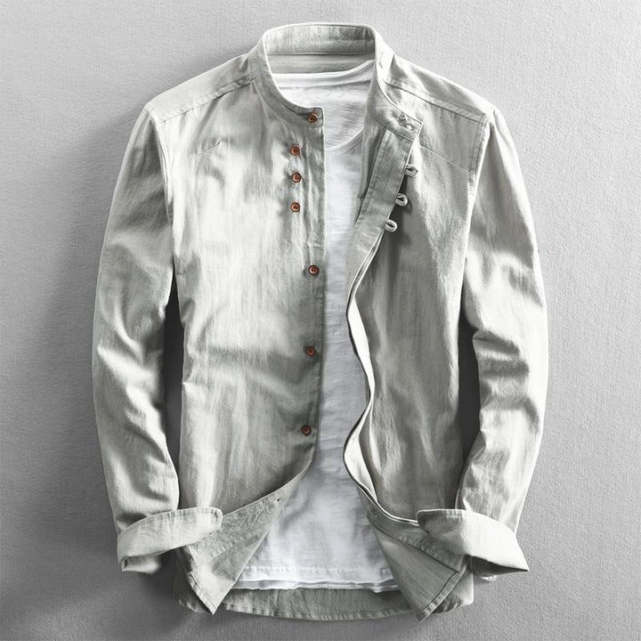 Stylish men's band collar button-down shirt for everyday wear. Modern design with roll tab sleeves.
