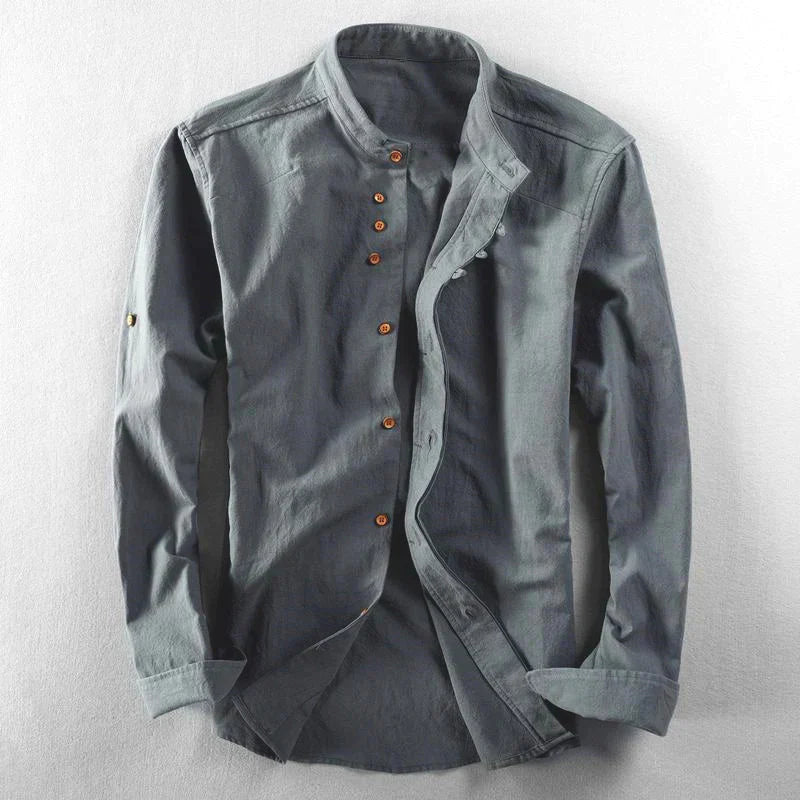 Modern men's fashion: band collar casual shirt with button-down front and adjustable roll tab sleeves.