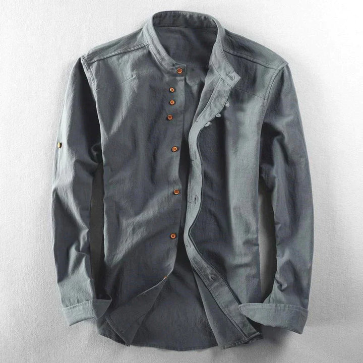 Modern men's fashion: band collar casual shirt with button-down front and adjustable roll tab sleeves.
