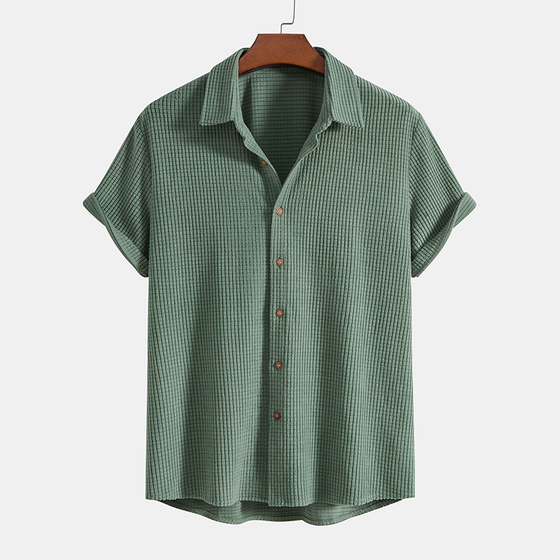 Men's beige short sleeve button-up shirt and matching casual shorts for summer fashion.