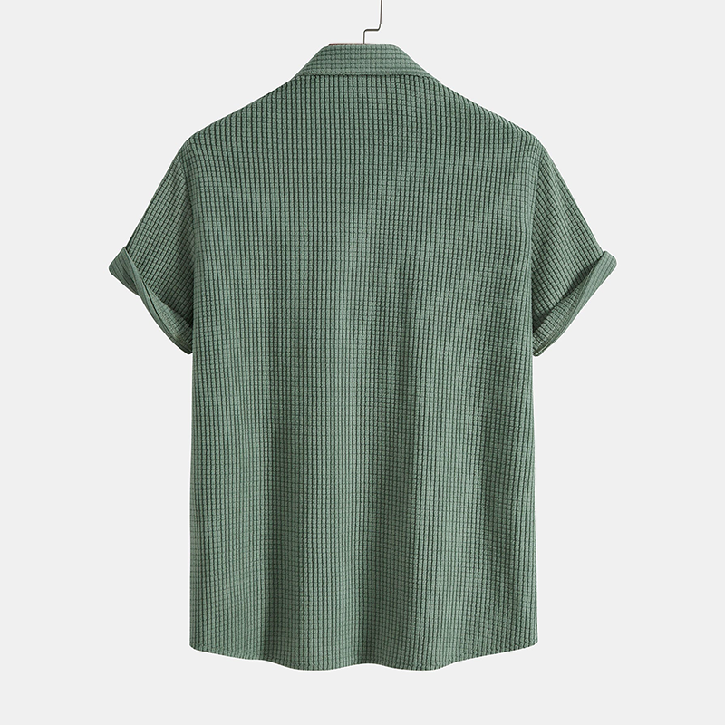 Men's casual green summer two-piece outfit featuring a short-sleeve button-up shirt and shorts.