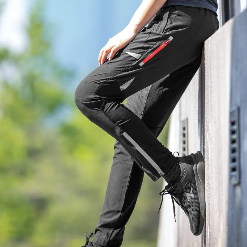 Performance stretch cycling pants for men, featuring a tapered fit and moisture-wicking fabric.