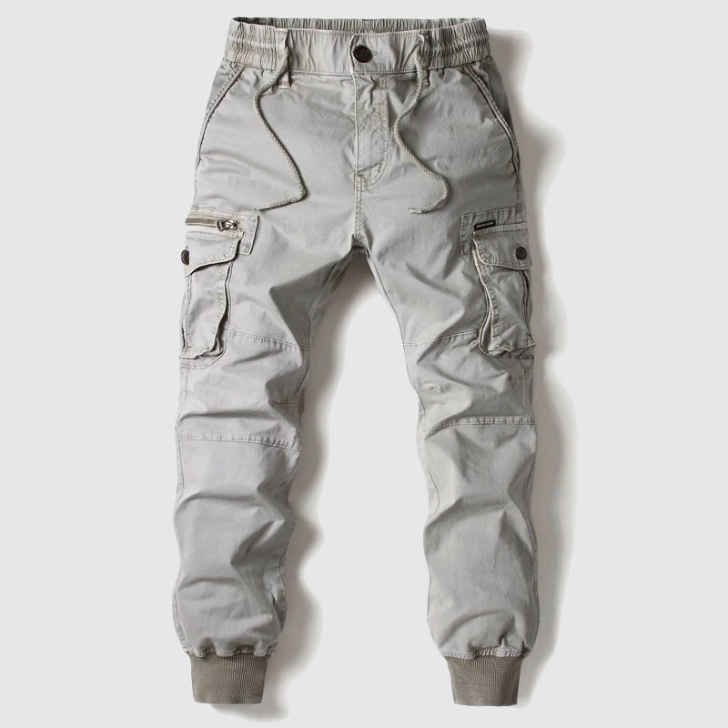 Functional men's black pants with jogger style and cargo pocket details.
