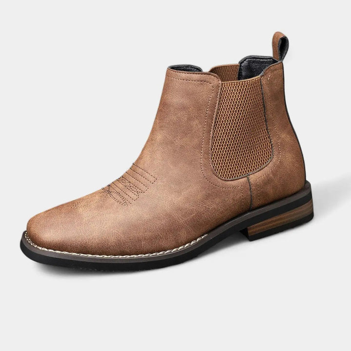 Men's black Chelsea ankle boots with intricate western stitch detail, ideal for smart casual wear.