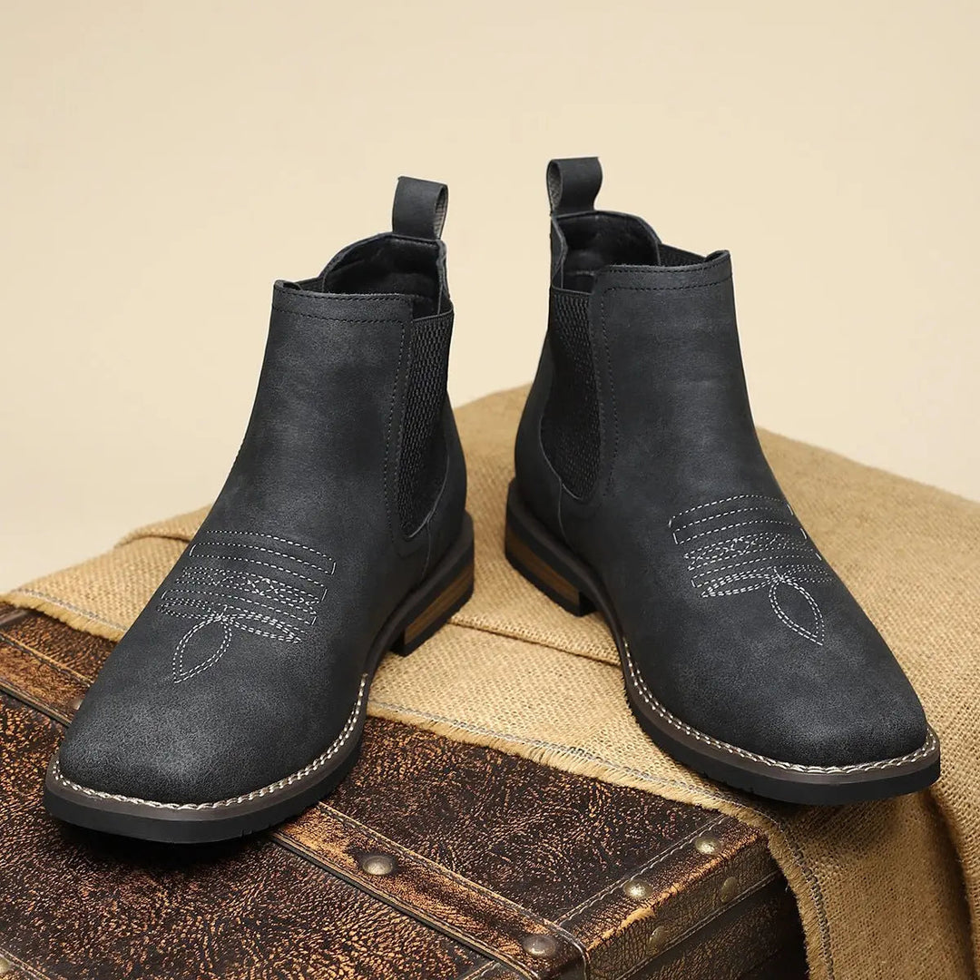 Men's smart casual black Chelsea boots with a modern western stitch detail and sturdy block heel.