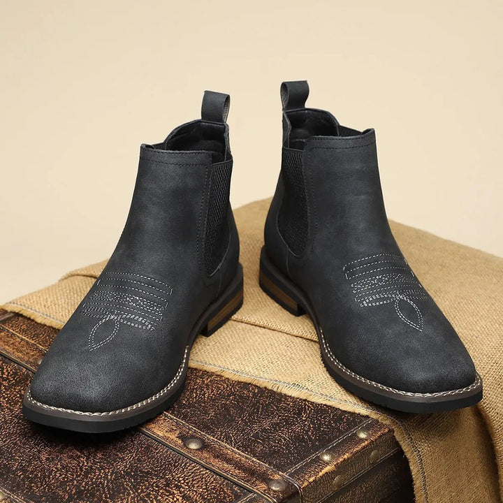 Men's smart casual black Chelsea boots with a modern western stitch detail and sturdy block heel.