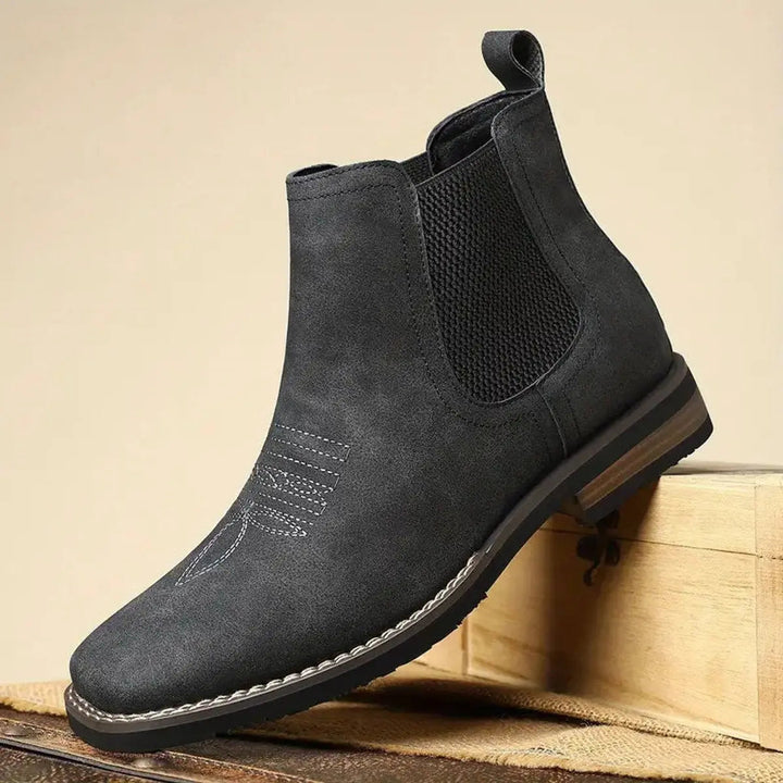 Step into style with men's black Chelsea boots, western stitch design, great for everyday sophistication.