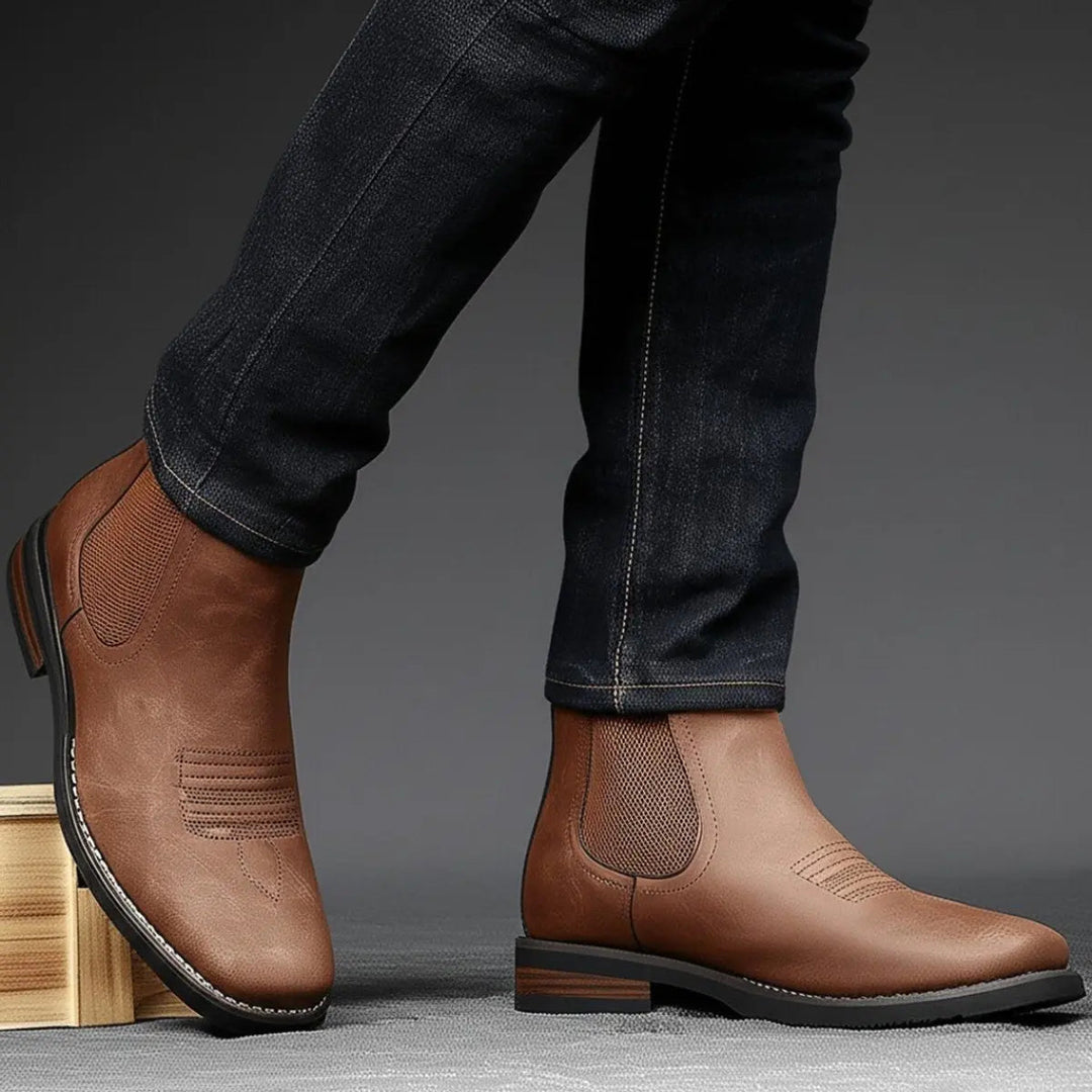 Stylish men's slip-on Chelsea boots, black leather with classic western stitching and block heel.