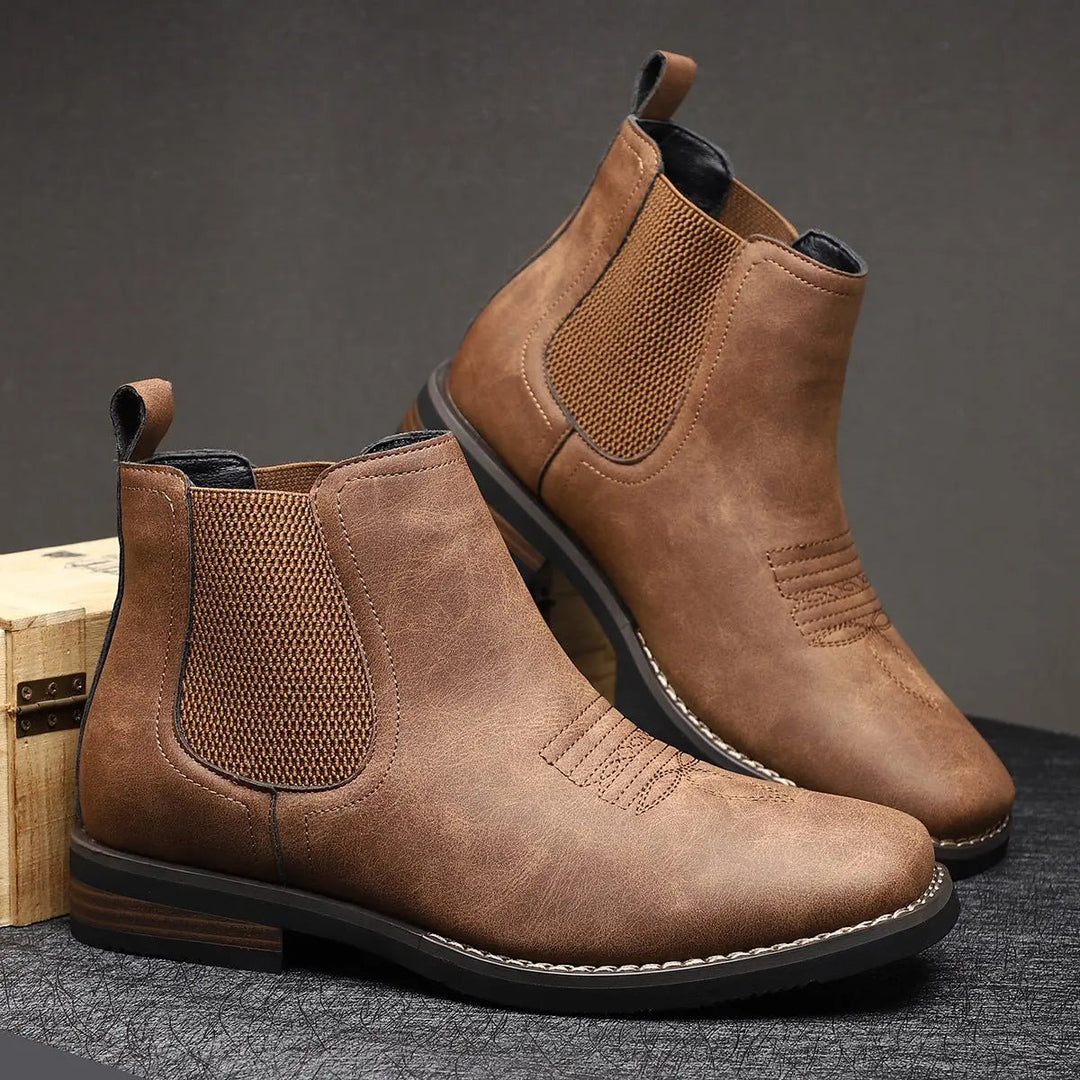 Pull-on men's black Chelsea boots, smart casual, featuring eye-catching western stitch design.