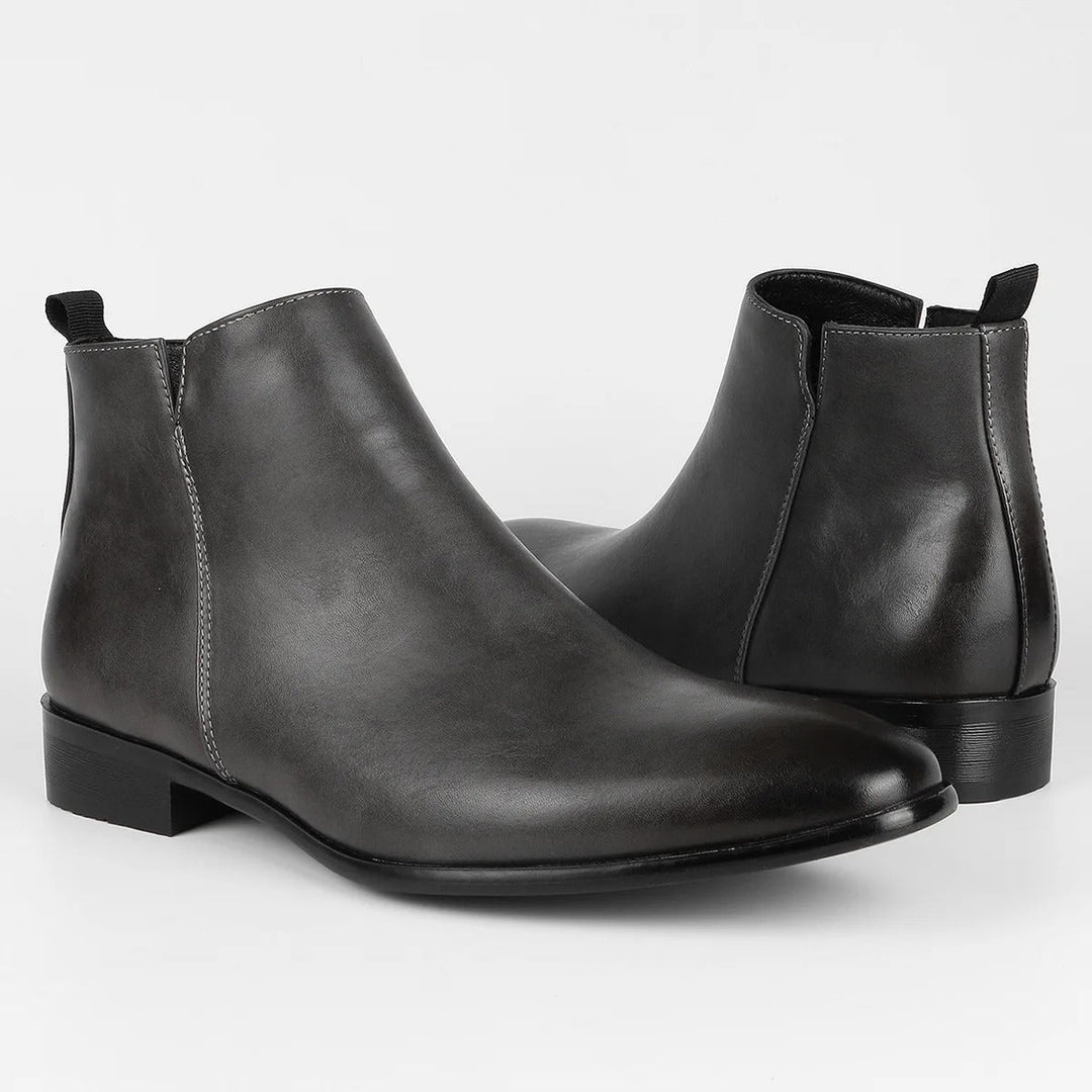Top-down view of men's black retro ankle boots, classic design, comfortable interior, durable.
