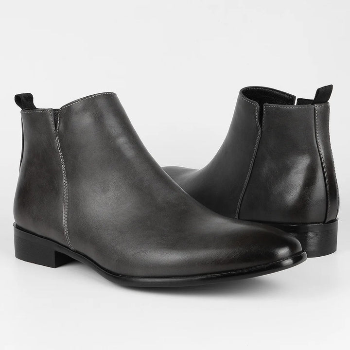 Top-down view of men's black retro ankle boots, classic design, comfortable interior, durable.