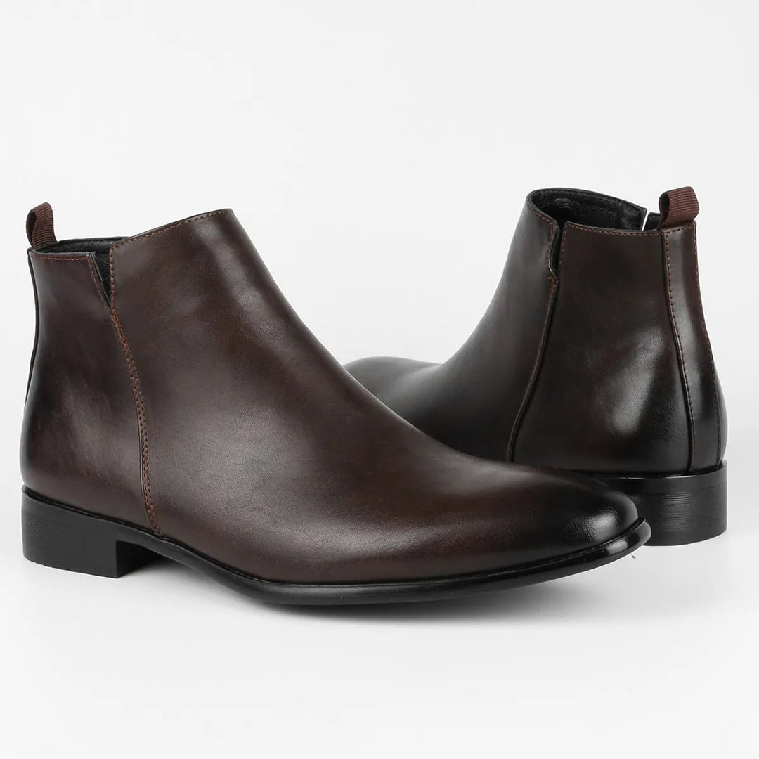 Man wearing comfortable black retro ankle boots with casual jeans, vintage style, timeless design.