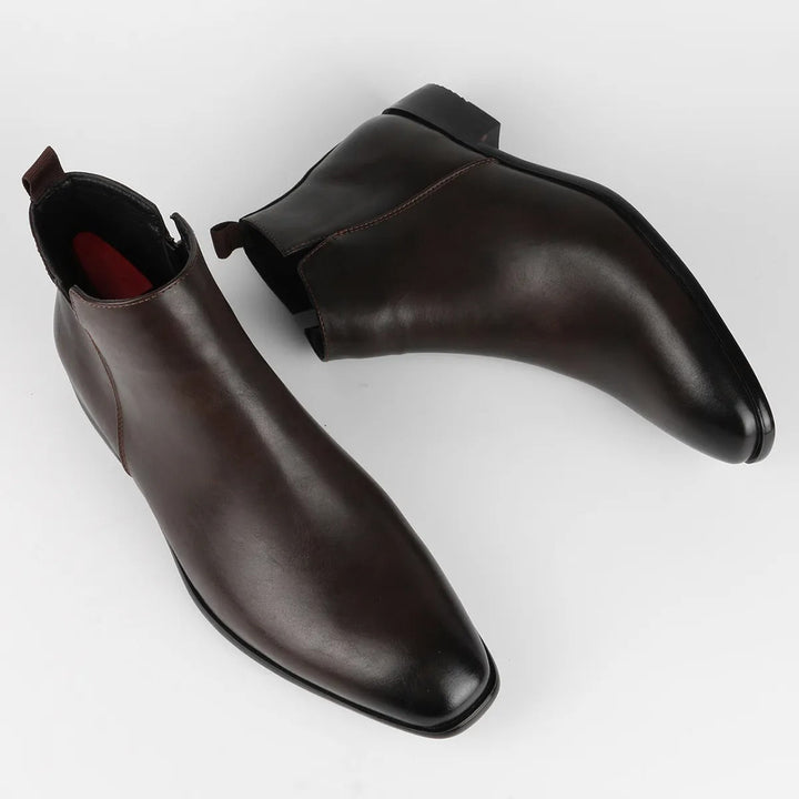 Men's classic brown ankle boots paired with formal attire, timeless, stylish, and comfortable.