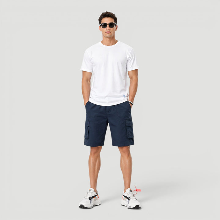 Relaxed fit men's cargo shorts featuring a drawstring waist & side utility pockets, great for active casual comfort.
