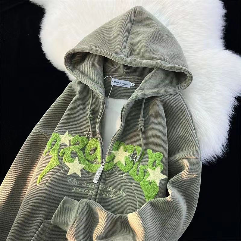 Close-up of detailed embroidery on a men's casual grey hooded sweatshirt.