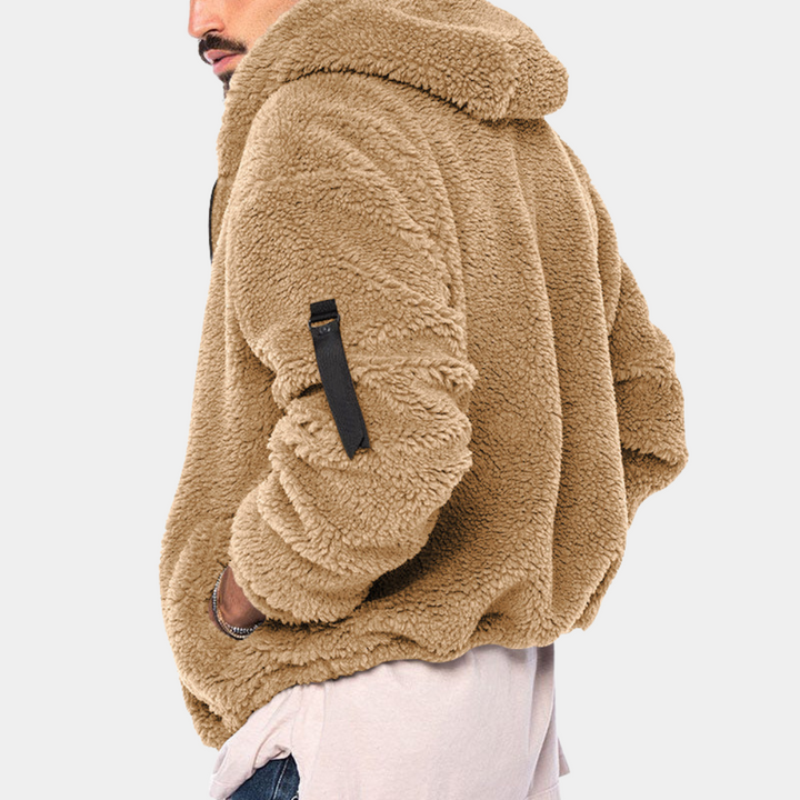 Stylish men's winter jacket with a cozy hood, designed for comfort & warmth in cold weather fashion.