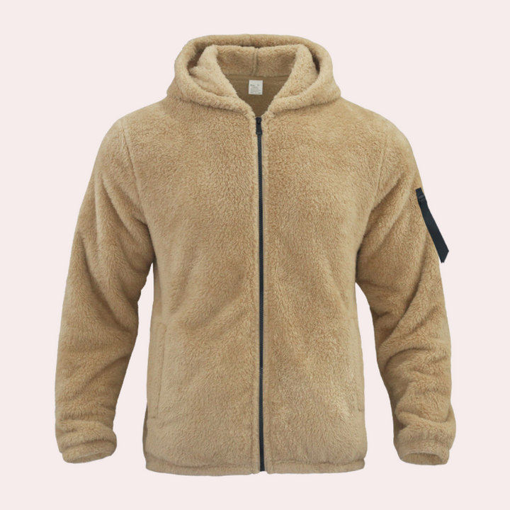 Comfortable men's zip-up winter jacket, featuring a warm hood & durable fabric for cold weather layering.