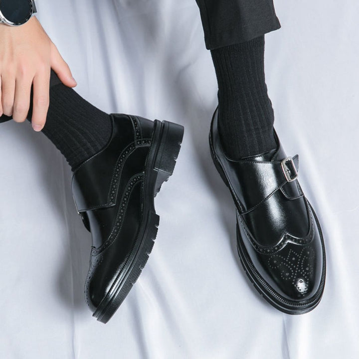 Stylish men's formal leather shoes featuring monk strap and elegant wingtip brogue.
