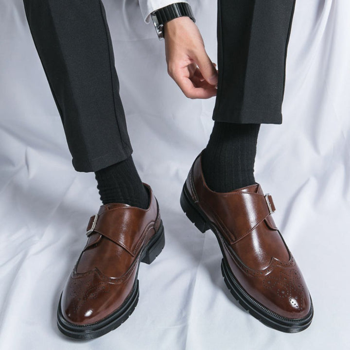 Men's oxford-style dress shoes with monk strap and wingtip brogue in rich brown leather.