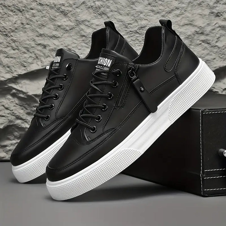 Men's black leather side zip trainers for smart casual style.