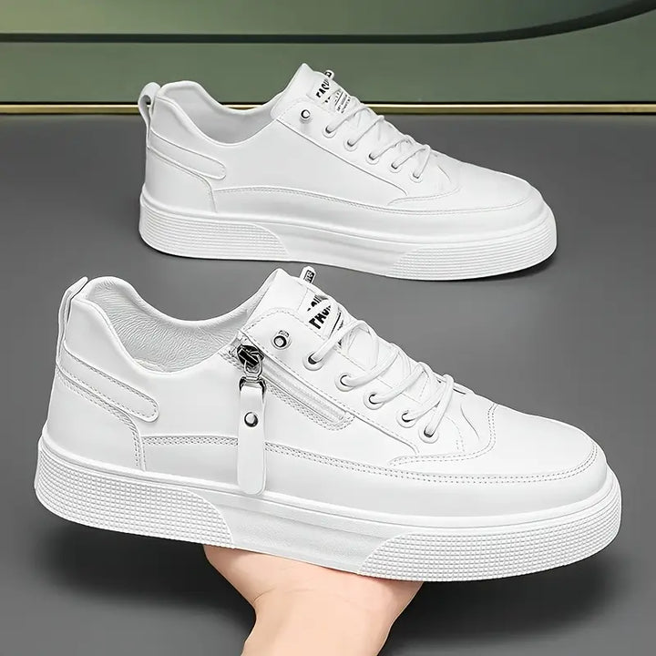 Men's smart casual footwear: black leather side zip trainers.