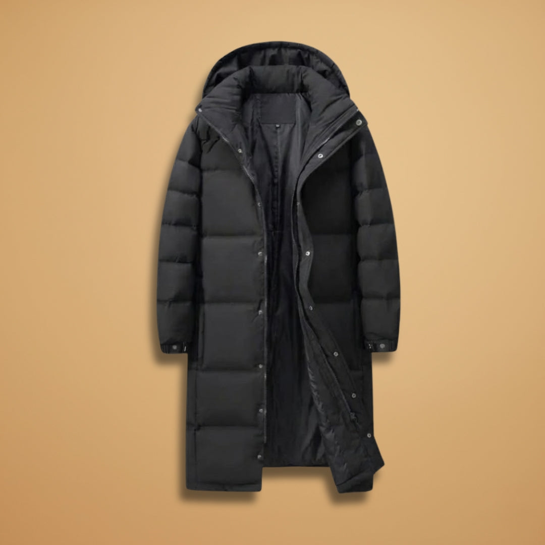 Men's black long quilted winter jacket with hood, offering warmth and below-knee coverage for cold weather.