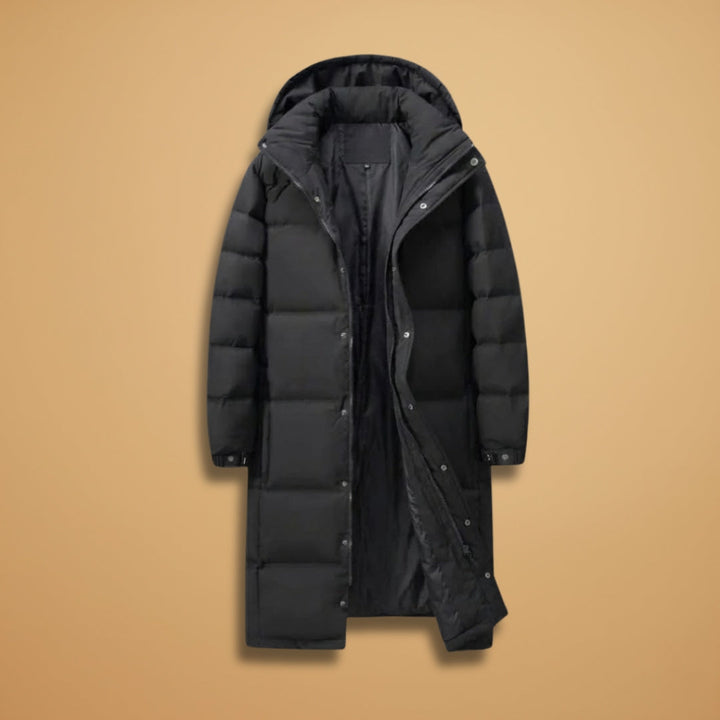 Men's black long quilted winter jacket with hood, offering warmth and below-knee coverage for cold weather.