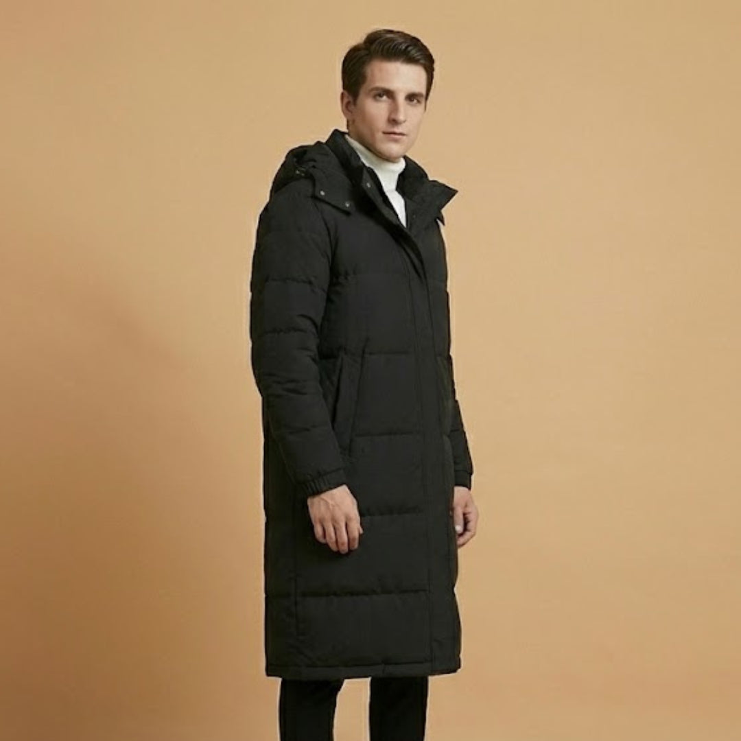Durable men's quilted long jacket for winter. Hooded design and warm insulation perfect for cold weather fashion.
