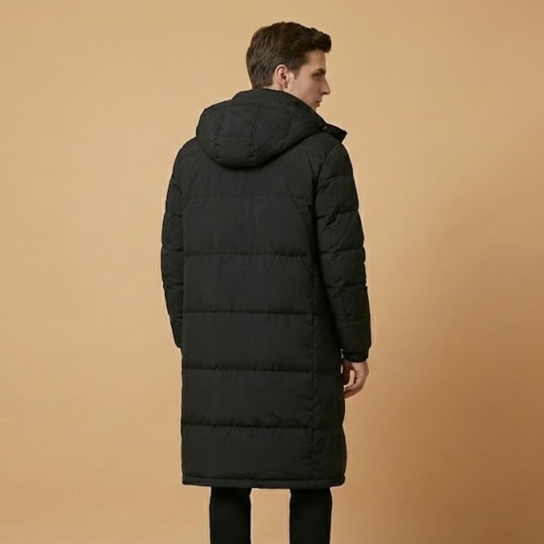 Full-length view of men's dark quilted winter jacket with hood, showing insulation for ultimate cold weather protection.