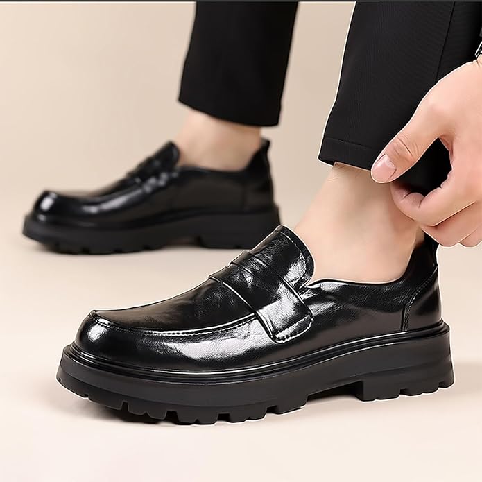 Men's black penny strap moc toe slip-on loafers. Classic, comfortable dress shoes for formal or casual wear.