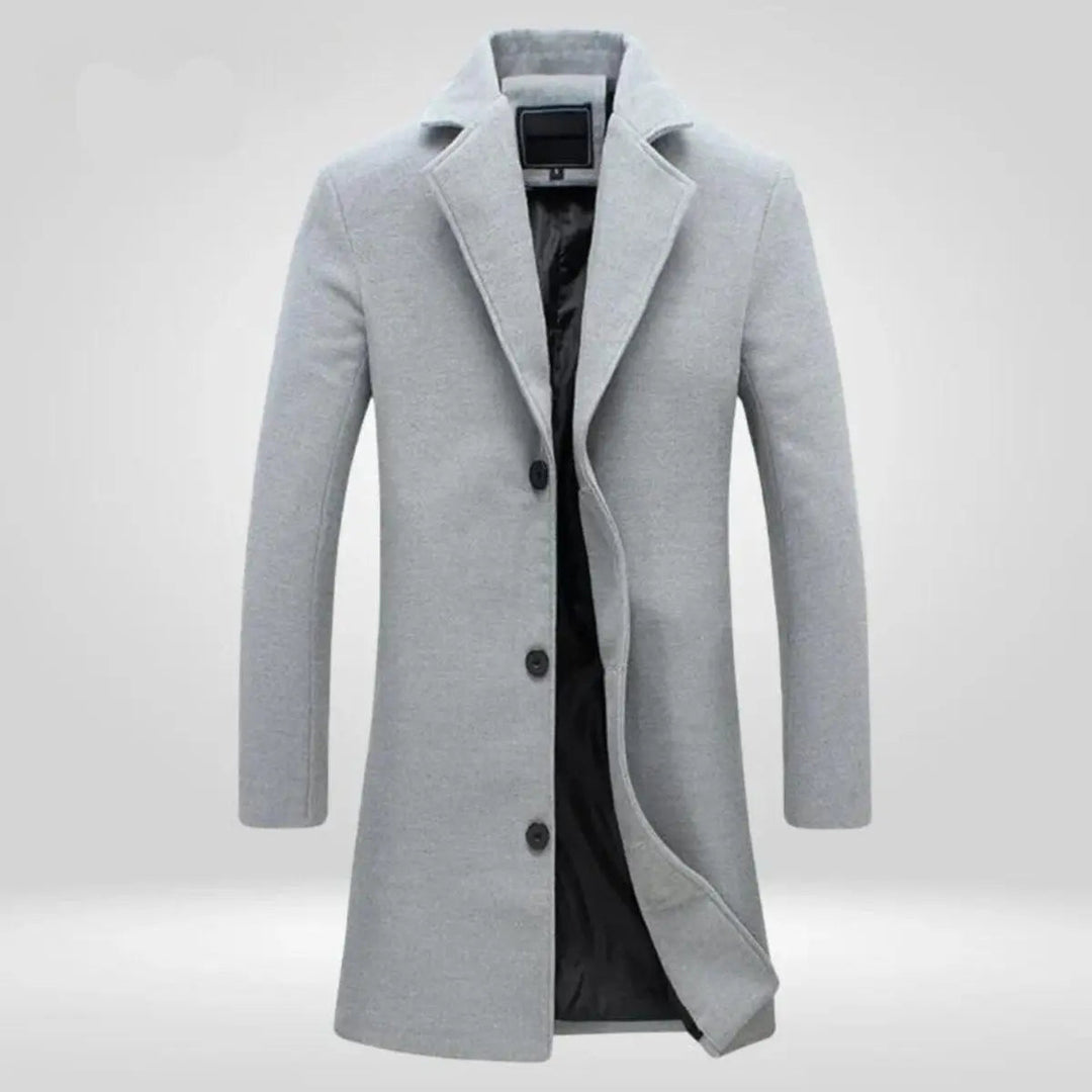 Tailored men's grey long overcoat. A stylish single-breasted winter outerwear essential for smart-casual fashion.