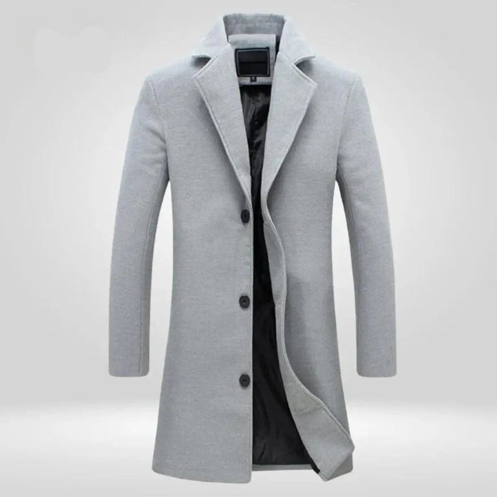 Tailored men's grey long overcoat. A stylish single-breasted winter outerwear essential for smart-casual fashion.