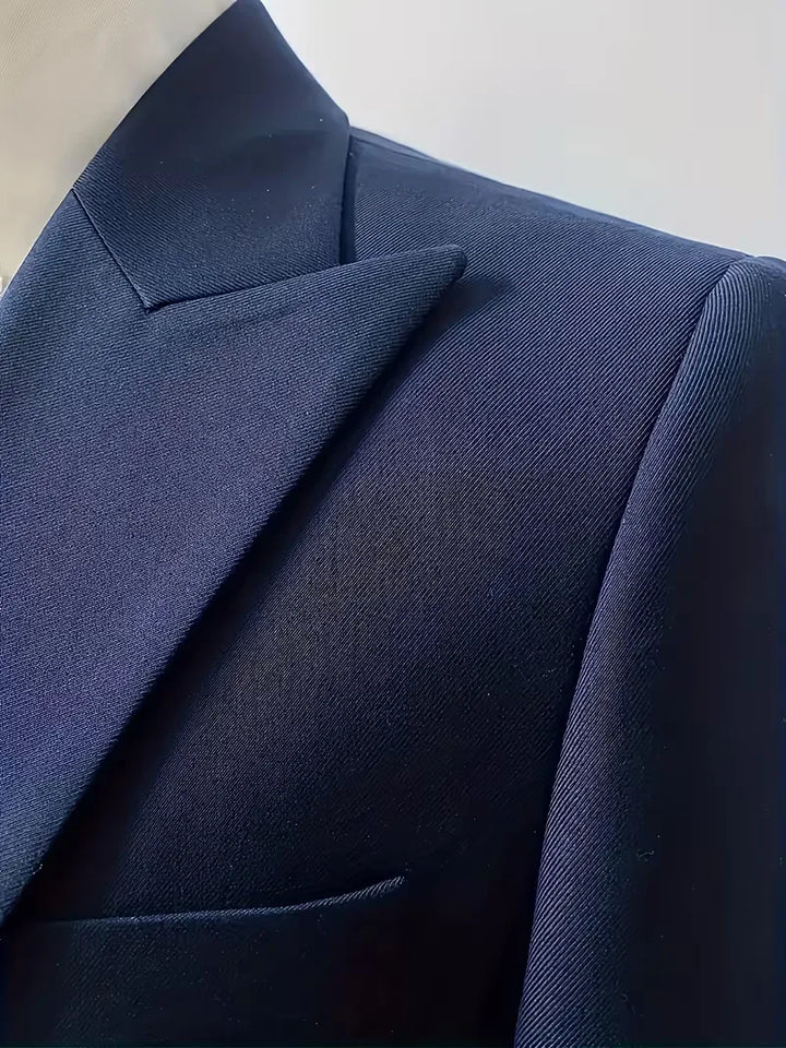 Men's three-piece suit, emphasizing the double-breasted waistcoat design.