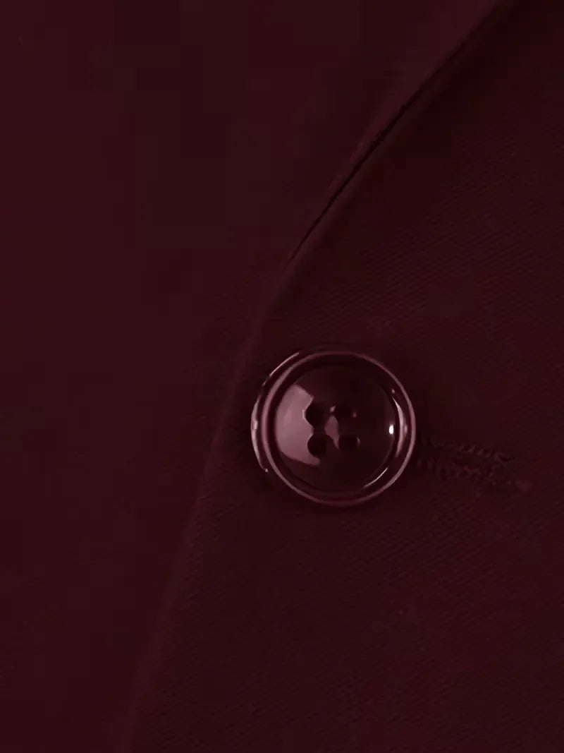 Contemporary men's black formal suit, slim fit and three-piece design.