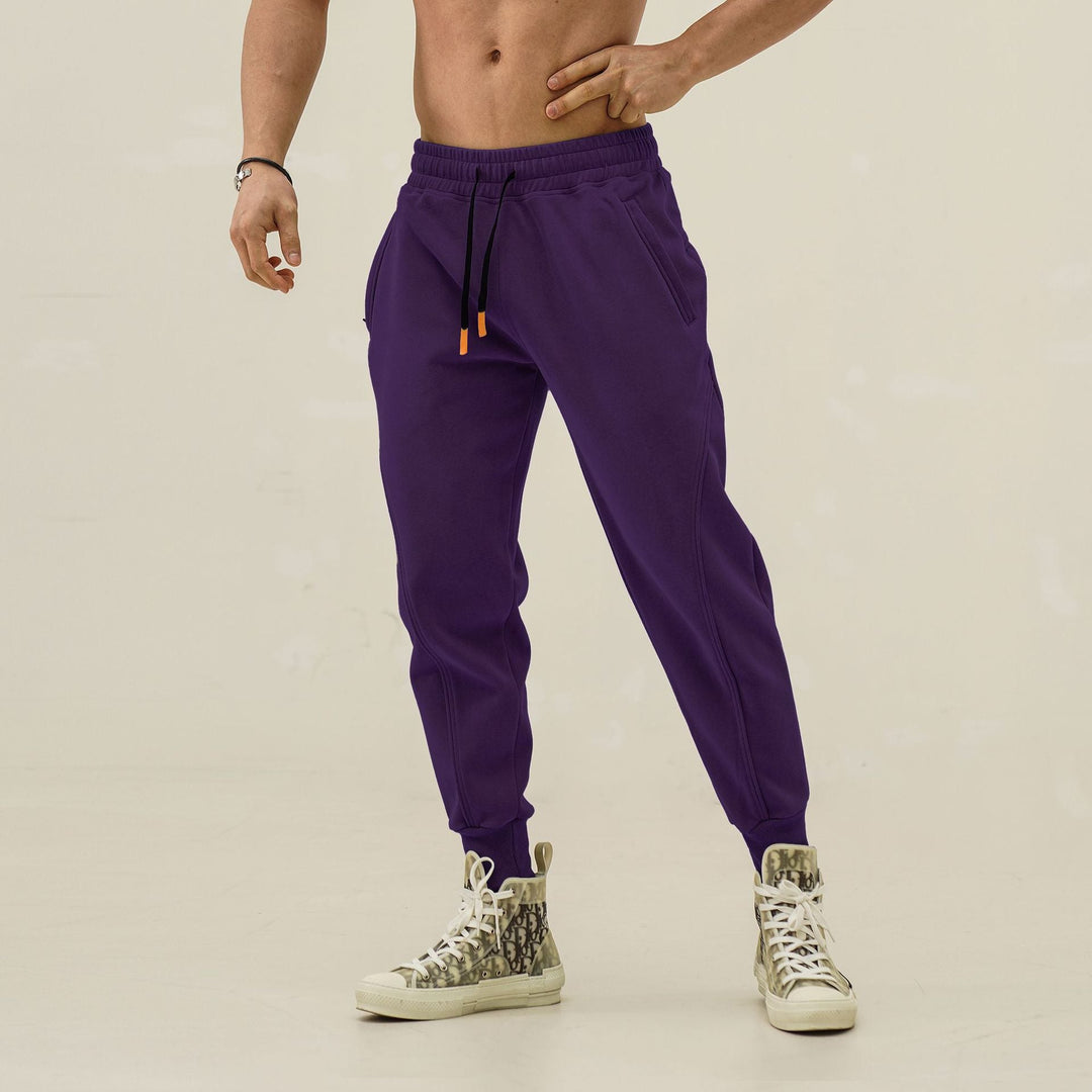Navy men's sweatpants, elastic waistband, trendy side stripes. Great for athletic and casual comfort.