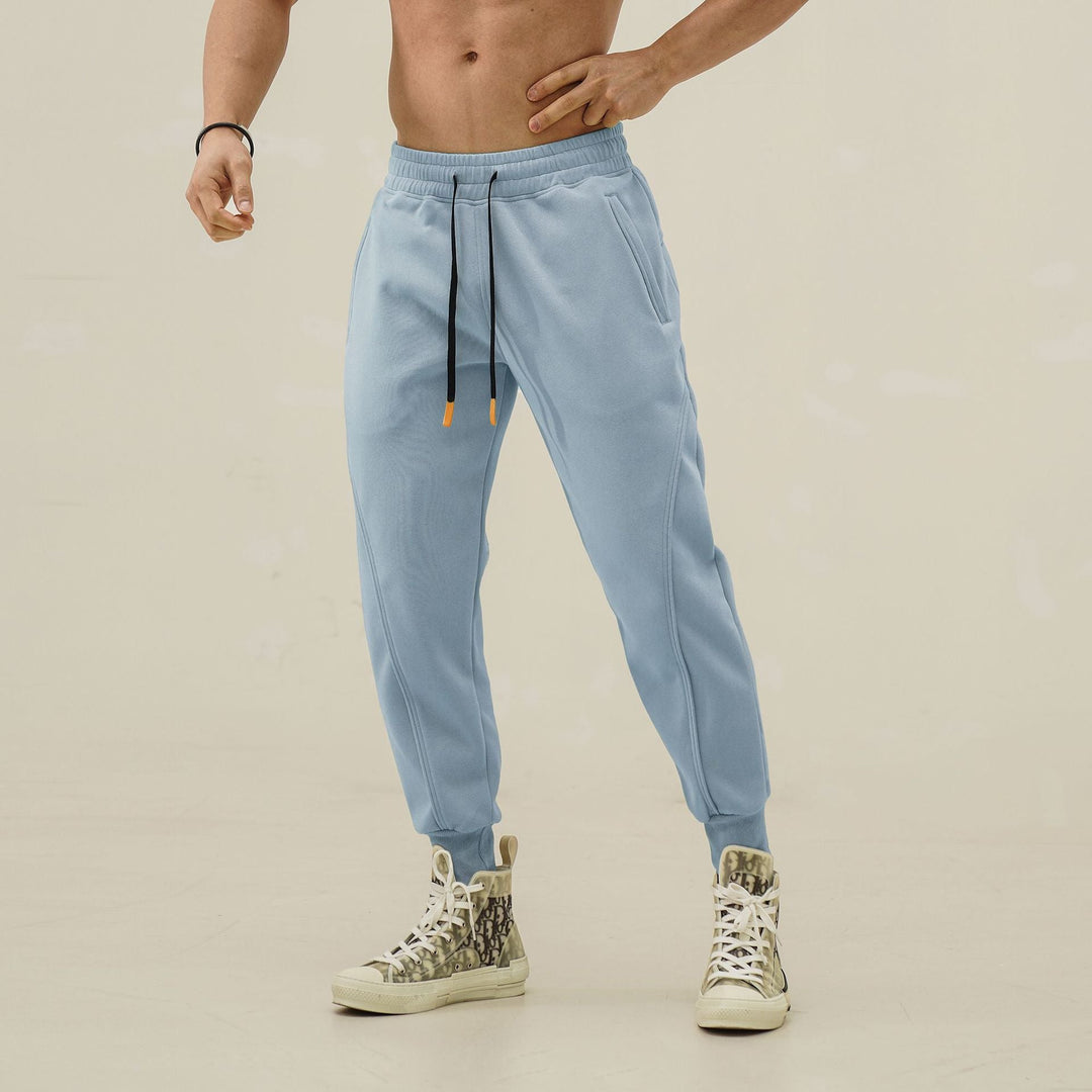 High-quality men's performance jogger pants with elastic waist and stylish stripes for all activities.
