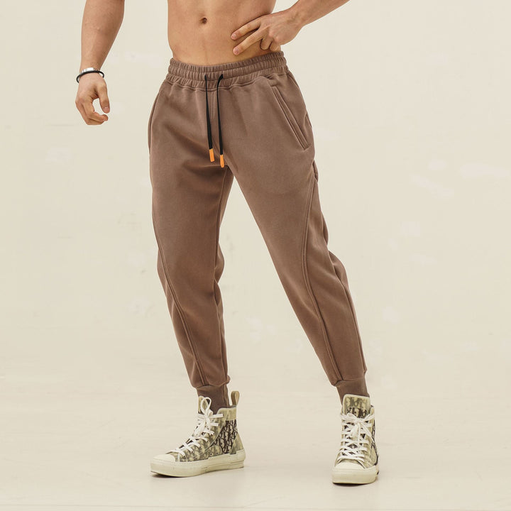 Modern men's casual jogger pants, elastic waist, sporty stripes. Comfortable & stylish for any day.