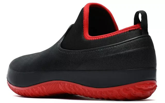 Man wearing men's waterproof slip-on work shoes, demonstrating comfort and grip
