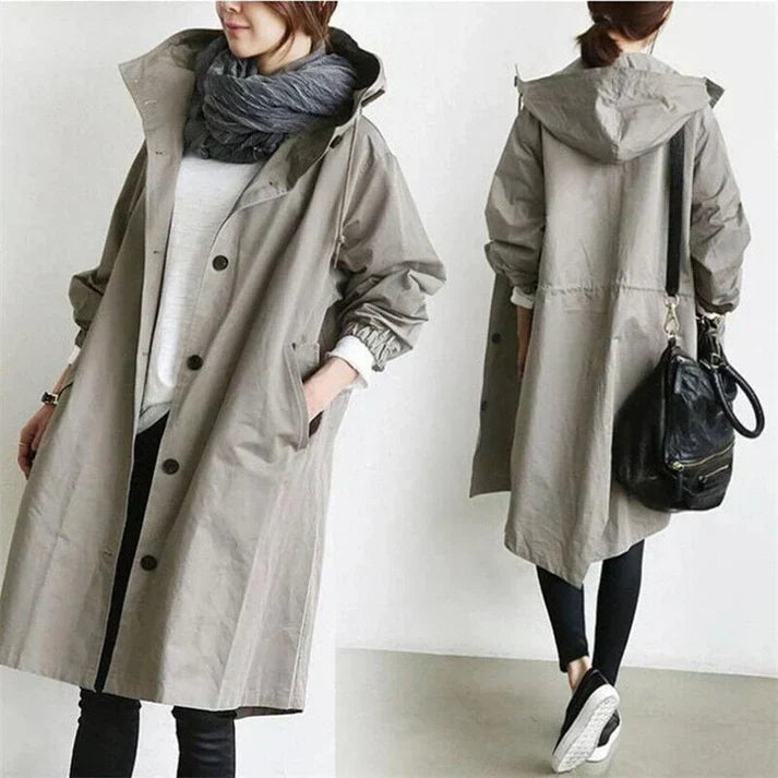 Men's black waterproof trench coat with hood, ideal for rainy weather. Stylish long rain jacket for men.