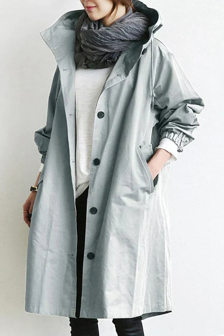 Stylish men's hooded trench coat in navy, offering warmth and weather protection. Elegant long fashion outerwear.