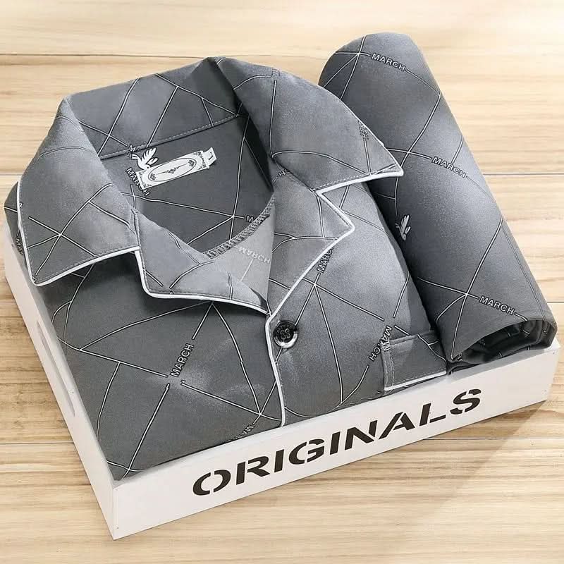 Full shot of men's grey sleepwear set, button-up top and matching pants.