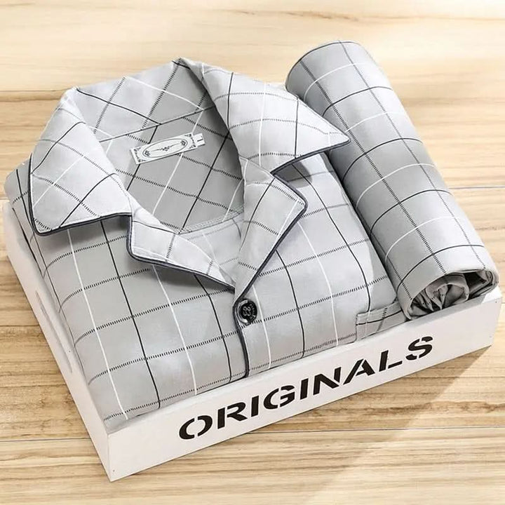 Men's classic button-up pajama set in navy blue, perfect gift.