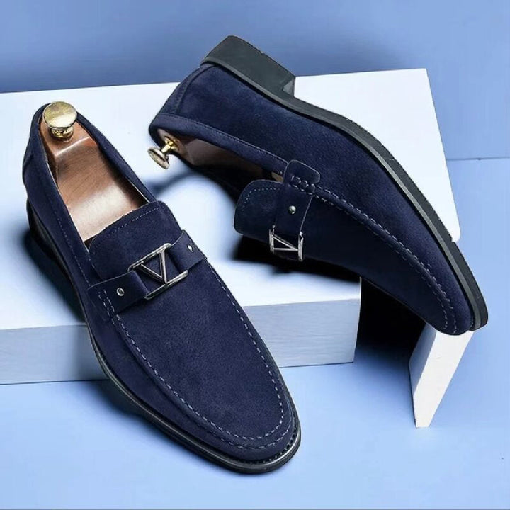 Men's blue slip-on loafers with metal bit detail, smart formal footwear