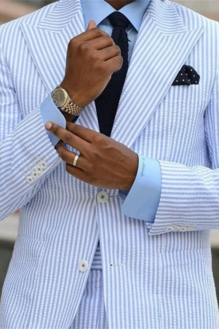 Celeste London men's tailored formal suit featuring a blue stripe pattern and elegant peaked lapels, perfect for weddings.